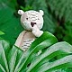 Soft toy tiger in a box